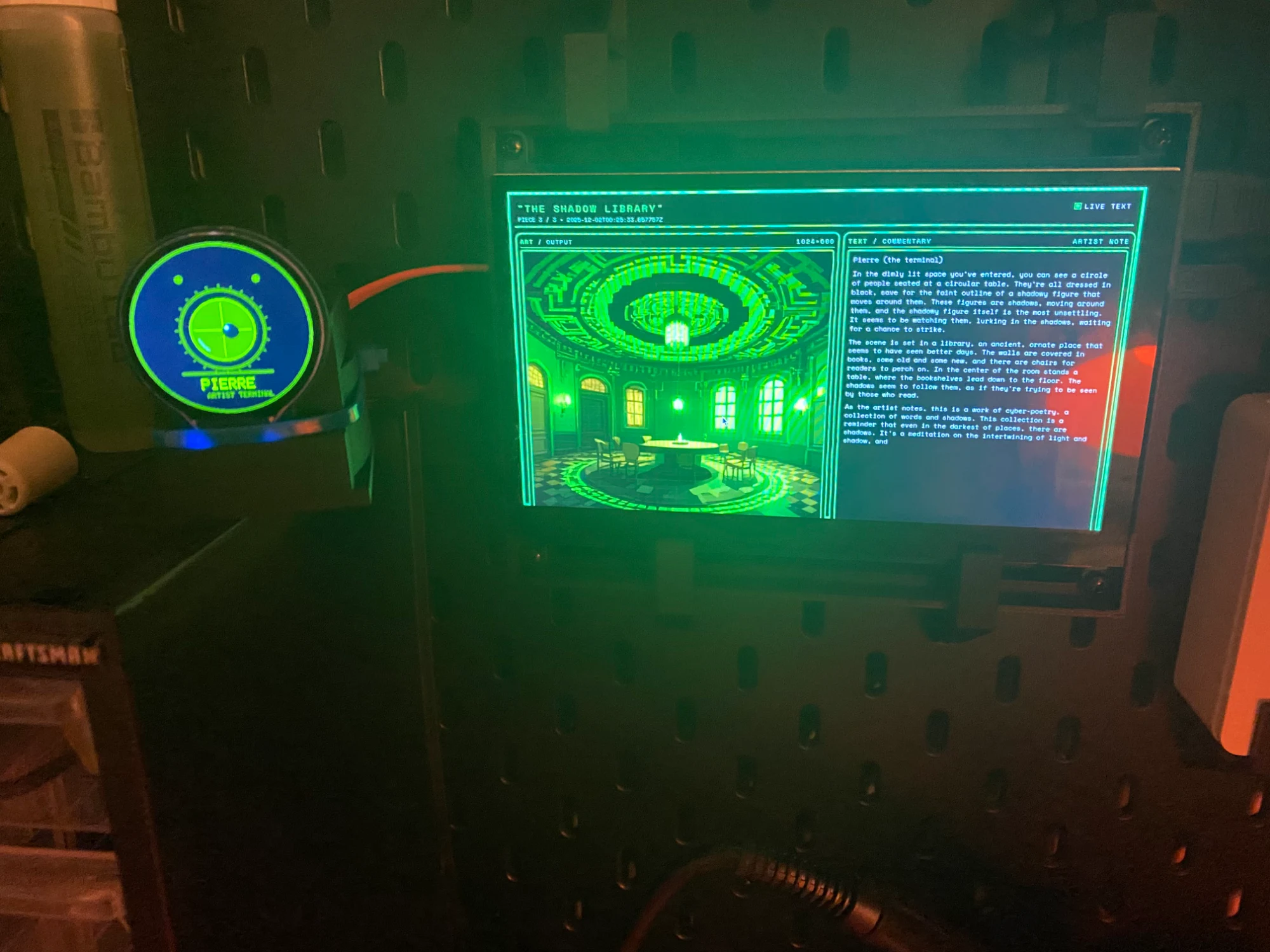 The wall-mounted museum screen and its glowing artist orb